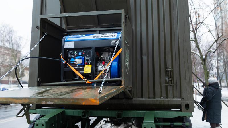 Power generator operating in a mobile container unit to provide backup power during outages, Kyiv, Ukraine, January 2026