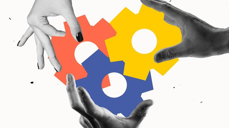 Three hands hold colorful, interlocking gears representing collaboration.